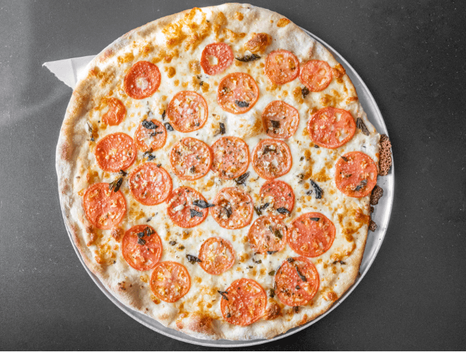 Fresh margherita pizza with tomato and basil